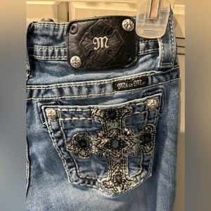 Miss Me jeans with embellished pockets.